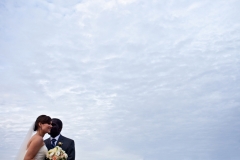 bride and groom sky